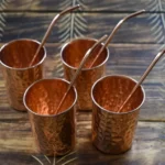 Copper hammered mugs with straws